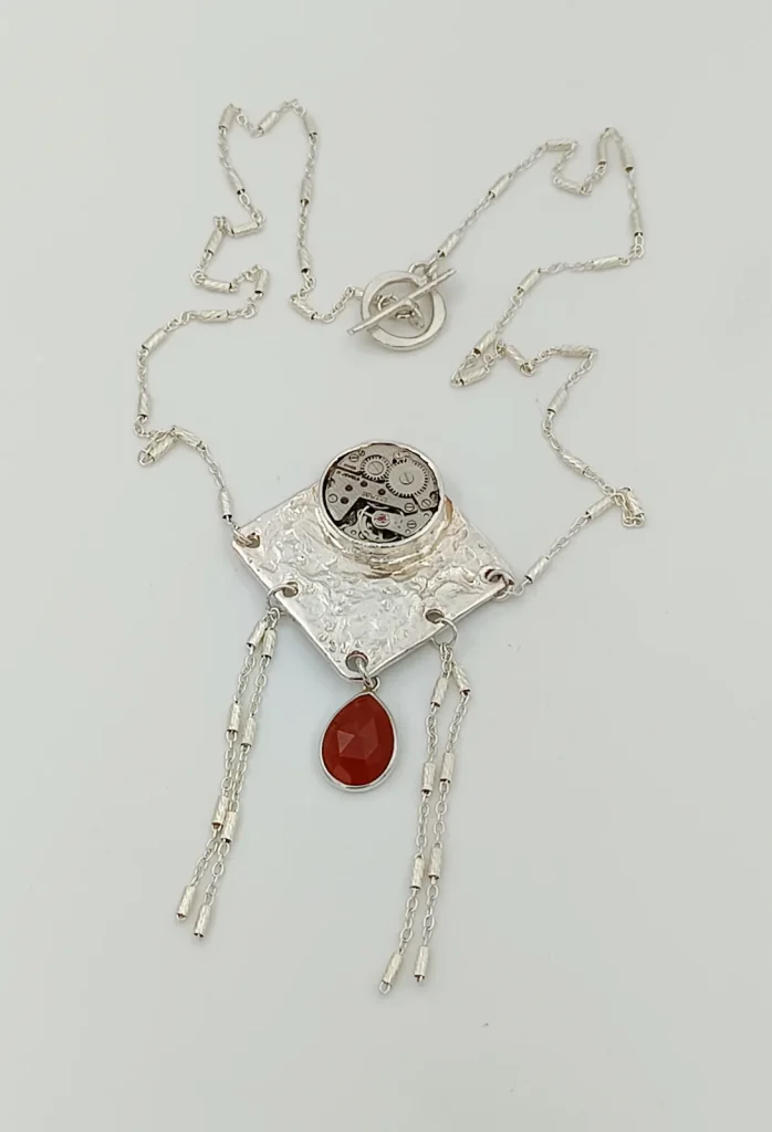 Collier argent onyx rubis montre suisse